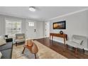 Cozy living room with neutral decor, hardwood floors, and a view of the entryway at 1331 Walker Ave, Atlanta, GA 30344