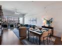 Open living and dining area with stylish furnishings, bright light, and hardwood floors at 1100 Howell Mill Rd # 404, Atlanta, GA 30318