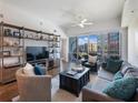 Cozy living room featuring a ceiling fan, balcony access, and stylish furniture at 1100 Howell Mill Rd # 404, Atlanta, GA 30318