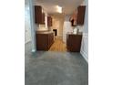 Eat-in kitchen with wood cabinets and laminate flooring at 2805 Vining Ridge Ter, Decatur, GA 30034