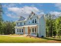 Charming two-story home with a covered porch and meticulously landscaped front yard at 1702 Eastside Parc St, Atlanta, GA 30316