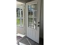 Bright, paneled front door and screen door of a home, offering light and ventilation at 698 Rocky Plains Rd, Covington, GA 30016