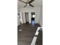 Open floor plan with stylish floors, ceiling fan, and natural light in the inviting living space at 698 Rocky Plains Rd, Covington, GA 30016
