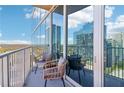 Cozy balcony with comfortable seating and panoramic views of the city skyline at 860 Peachtree Ne St # 1903, Atlanta, GA 30308