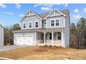 Beautiful two-story home with a gray exterior, white trim, and a spacious two-car garage at 109 Laurelwood Ln, Dallas, GA 30157