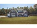 Beautiful two story home with a large front lawn and a three car garage in a quiet neighborhood at 255 Old Town Rd, Dacula, GA 30019