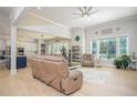 Bright living room featuring hardwood floors, neutral walls, and an open layout with a kitchen view at 255 Old Town Rd, Dacula, GA 30019
