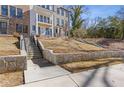 Stone stairway leads to charming townhome with front balcony at 1788 Peach Blossom Ne Ln # 45, Atlanta, GA 30324