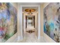 Bright hallway showcasing artwork and access to elevator at 88 W Paces Ferry Nw Rd # 1740, Atlanta, GA 30305
