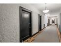 Long hallway featuring neutral carpeting, black door frames and bright lighting at 856 Briarcliff Ne Rd # 5, Atlanta, GA 30306