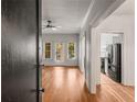 Bright living room with wood floors, ceiling fan, and access to the kitchen at 856 Briarcliff Ne Rd # 5, Atlanta, GA 30306