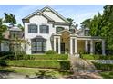 Image of the front exterior of the two-story luxury home, showcasing manicured landscaping and classic architectural details at 980 Fenimore Cir, Sandy Springs, GA 30350