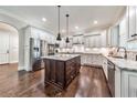 Spacious kitchen with stainless steel appliances, a granite island and bright white cabinetry at 2423 Rosapenna Nw Ln, Kennesaw, GA 30152