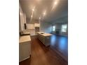 Modern kitchen with a large center island, granite countertops and stainless steel appliances at 277 Lakeside Pl, Canton, GA 30114
