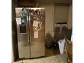 Kitchen featuring stainless steel refrigerator with water dispenser and window AC unit at 428 Poole Bridge Rd, Hiram, GA 30141