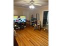 Relaxing living room with wood floors, and a flat-screen TV ready for entertainment at 428 Poole Bridge Rd, Hiram, GA 30141