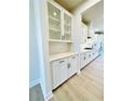 Bright kitchen with white cabinets, quartz countertops, a subway tile backsplash, and stainless steel appliances at 735 Crossroad Sw Ct, Powder Springs, GA 30127