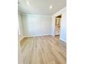 Spacious living room featuring hardwood floors and natural light from a large window at 735 Crossroad Sw Ct, Powder Springs, GA 30127