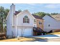 Two-story house with stone and siding accents, attached garage, and steps leading to the front entrance at 4118 Lost Springs Trl, Douglasville, GA 30135