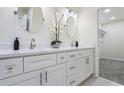 Elegant bathroom with double vanity, quartz countertop and walk-in closet at 1270 Graymont Sw Dr, Atlanta, GA 30310