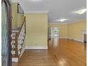 Spacious foyer with hardwood floors and staircase leading to upper level, adjacent to formal living room at 36 Latimer Nw Ln, Cartersville, GA 30121