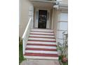 Close-up of the front door with steps leading up to the entrance, featuring white railing at 6579 Alford Way, Lithonia, GA 30058