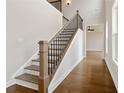 Elegant staircase with wood treads and black metal balusters at 509 Pearl St, Cumming, GA 30040