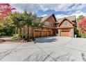 Three-car garage with a large circular driveway at 879 Big Horn Hollow, Suwanee, GA 30024