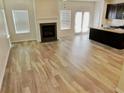 Open-concept living room featuring a fireplace and lots of space at 3978 Lake Manor Way, Atlanta, GA 30349