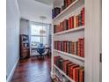 Cozy study area featuring custom built-in bookshelves and bright light from large windows at 57 Forsyth Nw St # 12B, Atlanta, GA 30303