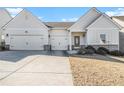 House exterior featuring a two-car garage and manicured lawn at 276 Villa Grande Dr, Locust Grove, GA 30248