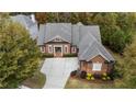 Brick home with a three-car garage and large backyard at 6202 Talmadge Nw Way, Acworth, GA 30101