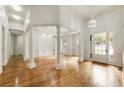 Bright and airy entrance with hardwood floors and columns at 6202 Talmadge Nw Way, Acworth, GA 30101