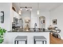 Stylish kitchen with granite countertops, stainless steel appliances, and a convenient breakfast bar at 3621 Vinings Slope Se # 1537, Atlanta, GA 30339