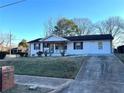 Single story home with a well manicured front yard and traditional curb appeal at 1370 Georgia Ave, Atlanta, GA 30344