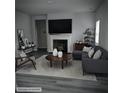 Cozy living room featuring a fireplace, sleek gray furniture, and elegant decor at 958 Fellowship Rd, Fairburn, GA 30213