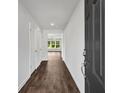 Inviting foyer with sleek flooring, neutral walls, and views into an open living space at 3270 Forest Green Dr, Douglasville, GA 30135
