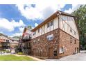 Exterior of brick condo building showing multiple units, stairs and parking area at 1177 Church St # F, Decatur, GA 30030