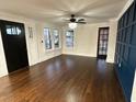 Bright living room with hardwood floors, and a view into the kitchen at 1134 Donnelly Sw Ave, Atlanta, GA 30310