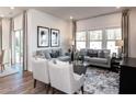 Cozy living room featuring comfortable seating, stylish decor, and ample natural light at 24 Dew Lake Ct, Grayson, GA 30017