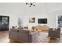 Bright living room featuring hardwood floors and stylish furniture at 2746 King Arthur Ct, Buford, GA 30519