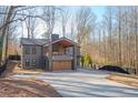 Two-story modern farmhouse with a large garage and private setting at 600 Jones Rd, Roswell, GA 30075