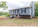 Charming two-story house with new landscaping and partial brick foundation at 3950 Yancey Rd, Douglasville, GA 30135