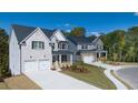 Community featuring several houses with similar design at 583 Princeton Elm Pl, Lawrenceville, GA 30045