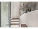 Bright entryway with hardwood floors and elegant staircase at 314 Cornett Way, Lawrenceville, GA 30046