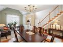 Spacious dining area with hardwood floors and a view of the living room at 1979 Spivey Village Dr, Jonesboro, GA 30236