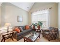 Cozy living room featuring a comfortable sofa and arm chair at 1979 Spivey Village Dr, Jonesboro, GA 30236