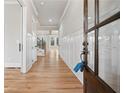 Bright foyer with hardwood floors, wainscoting, and a view of the staircase at 3816 Havenrock Drive, Marietta, GA 30066