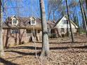 Charming two-story house with a brick facade, dormer windows, and a welcoming front porch at 25 Ridgeview Dr, Jonesboro, GA 30236