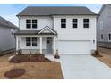 New construction two-story home featuring white siding, gray roof, covered front porch, and an attached two-car garage at 79 Hampton Ter, Dallas, GA 30157